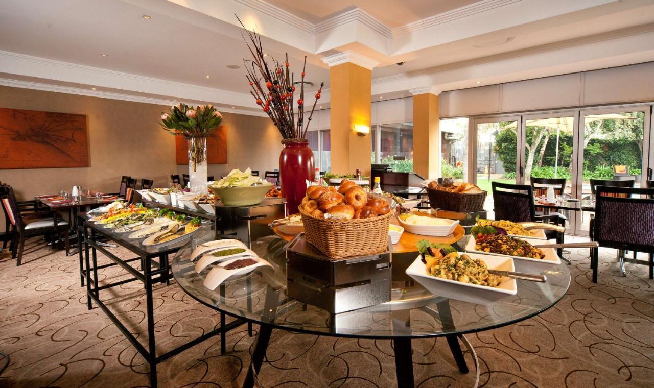 Southern Sun Or Tambo International Airport Kempton Park Exterior photo Breakfast buffet at a luxury hotel