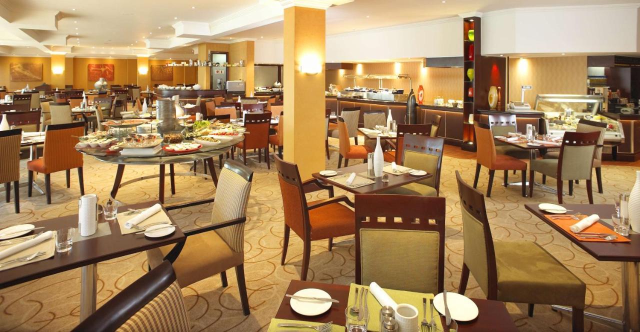 Southern Sun Or Tambo International Airport Kempton Park Exterior photo Restaurant